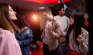Dubai nightlife venue with colorful club lighting and dance stage